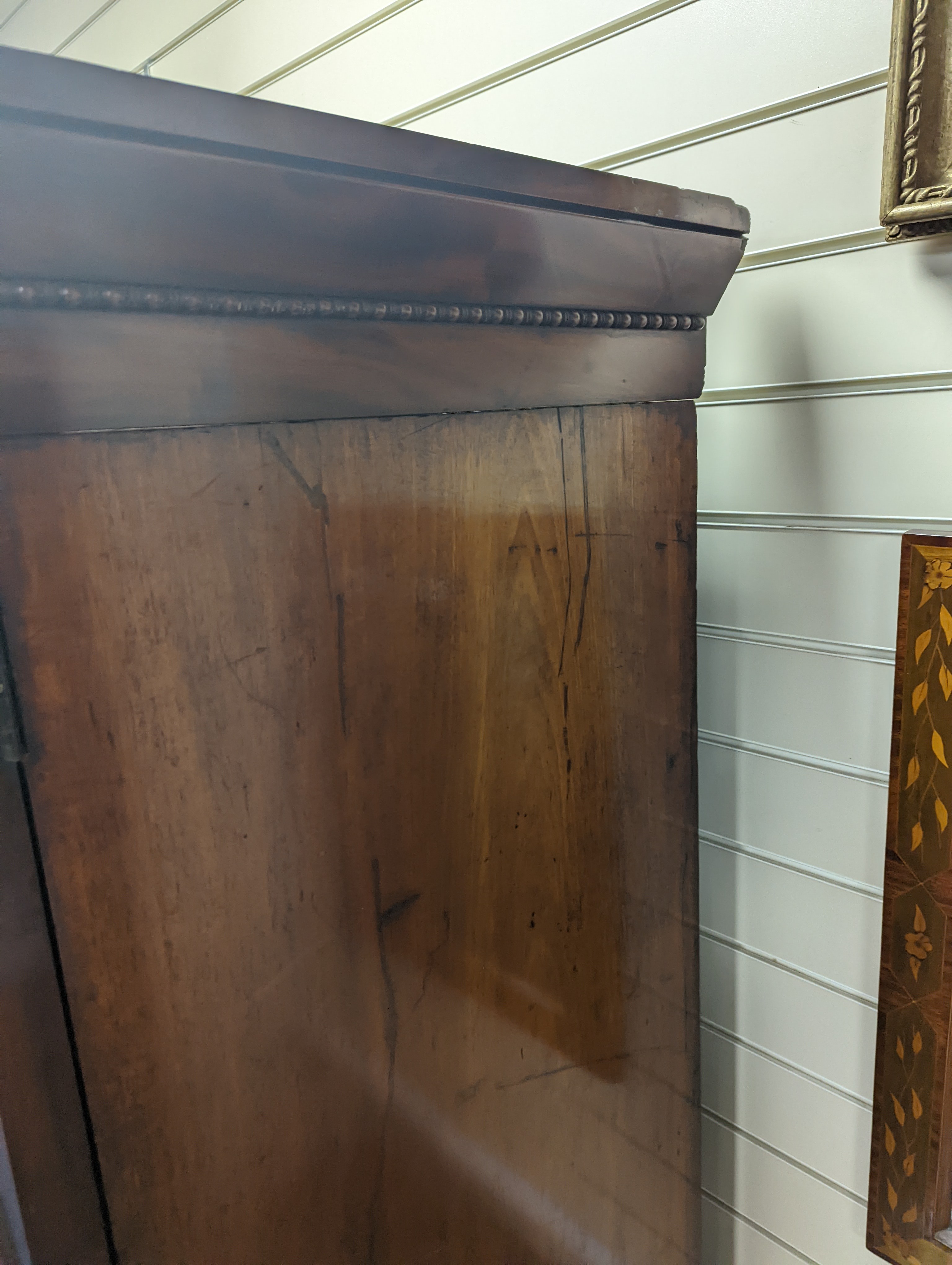 A William IV figured mahogany inverse breakfront compactum wardrobe, length 263cm, depth 70cm, height 197cm